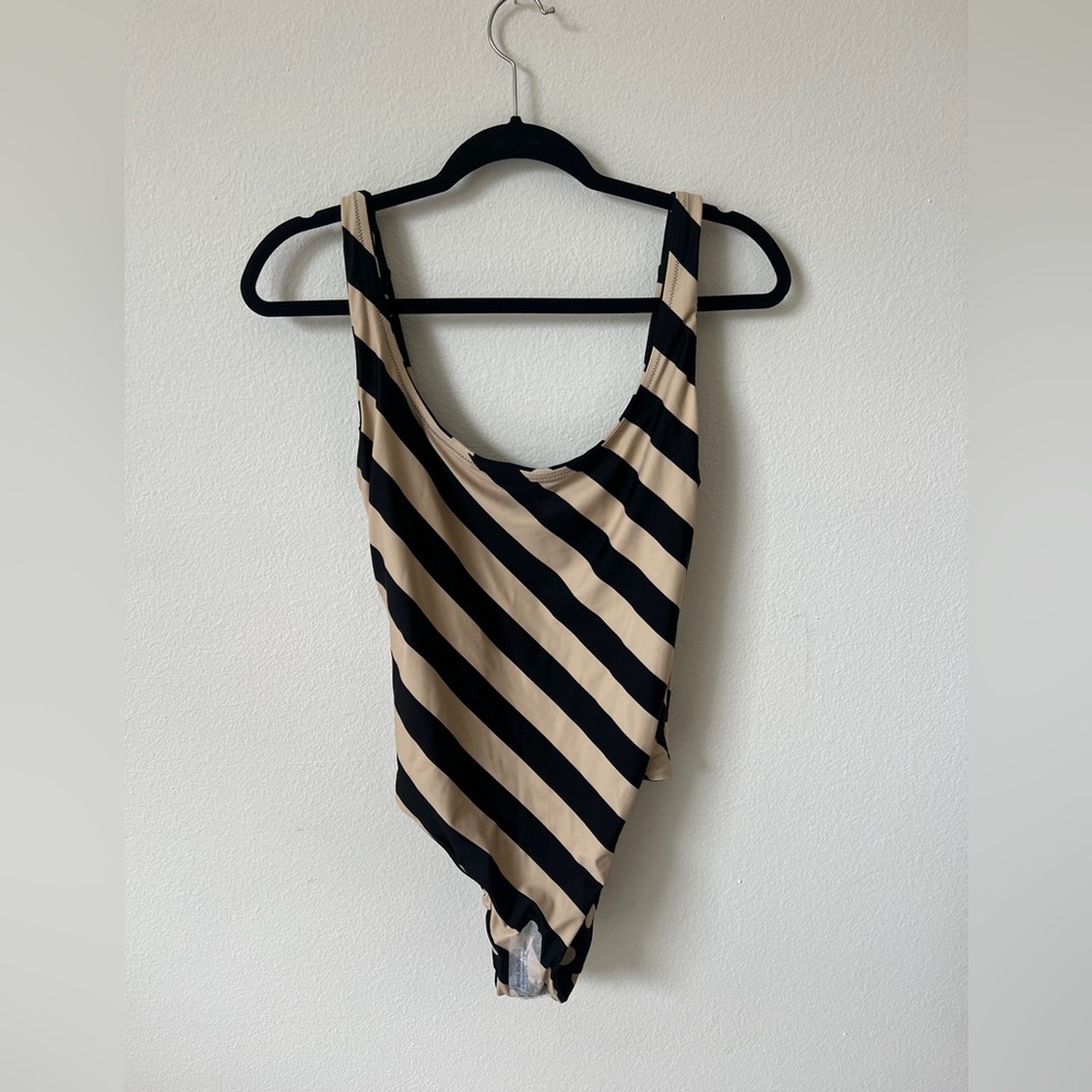 Scoopneck one-piece swimsuit in reversible polka dot stripe print.